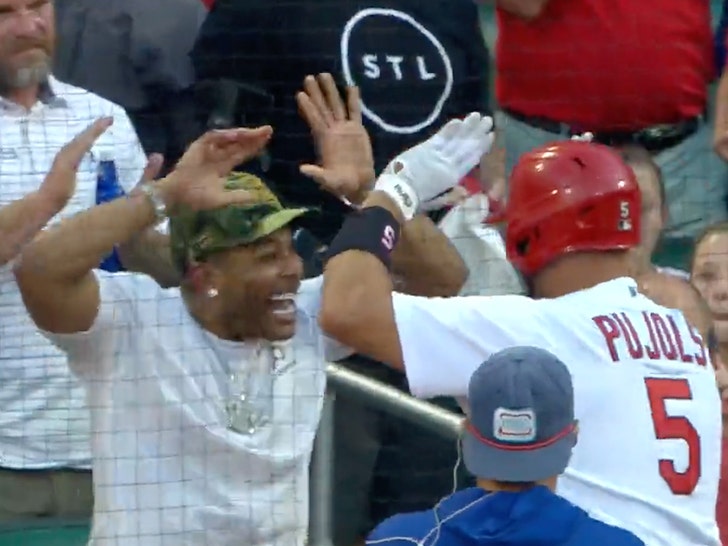 Albert Pujols giving his jersey to this young Cardinals fan