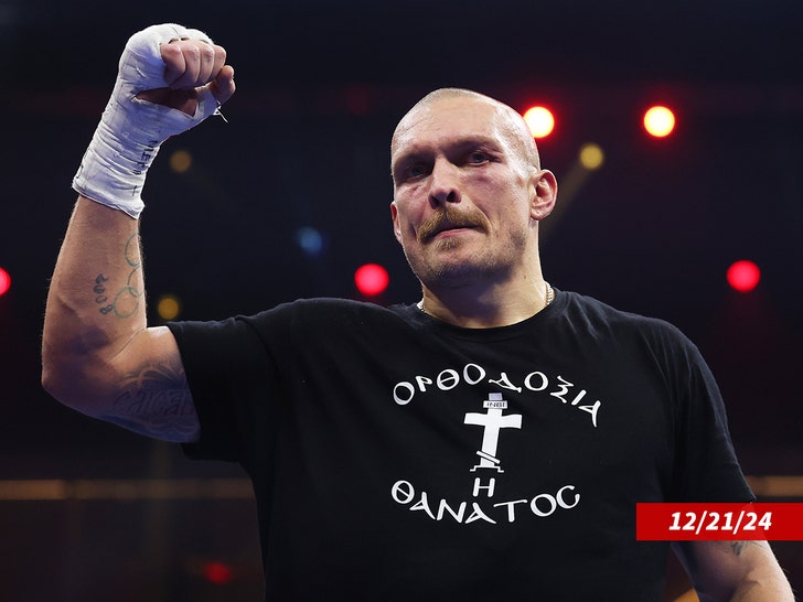 Oleksandr Usyk celebrates victory following the IBF, IBO, WBA, WBC and WBO Undisputed World Heavyweight titles' fight between Oleksandr Usyk and Tyson Fury