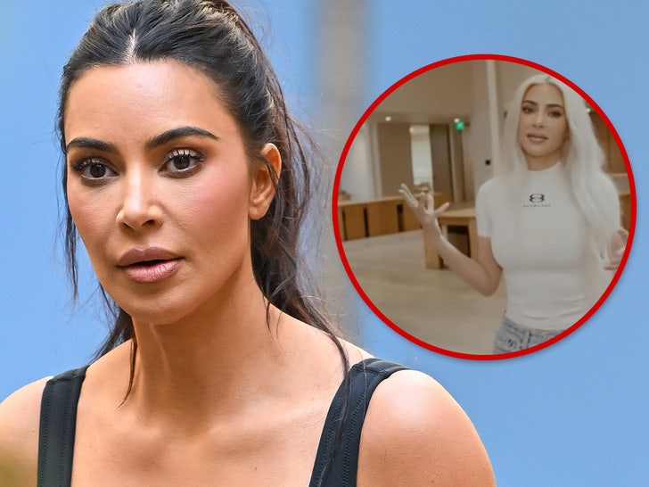Kim Kardashian wearing a white shirt in the SKKN office.
