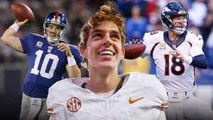 arch manning and eli manning and peyton manning getty 1