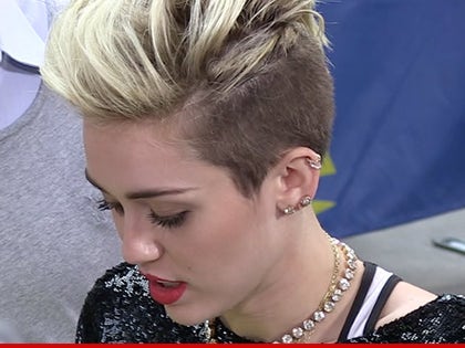 0523-miley-cyrus-tmz-01