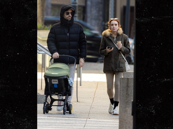 lindsay lohan and husband and his mom take stroll with baby in georgia