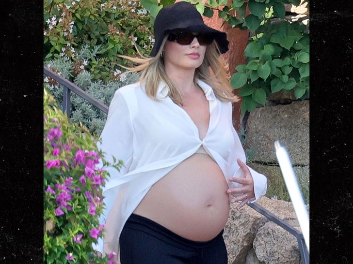 Margot Robbie Glows Showing Off Baby Bump In Sardinia With HusbandTom Ackerley