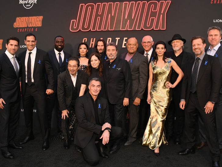Stars Wearing Blue Ribbons At 'John Wick' Premiere