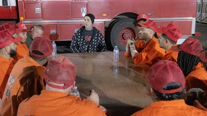 Travis Barker Sitting At A Table With Incarcerated Firefighters