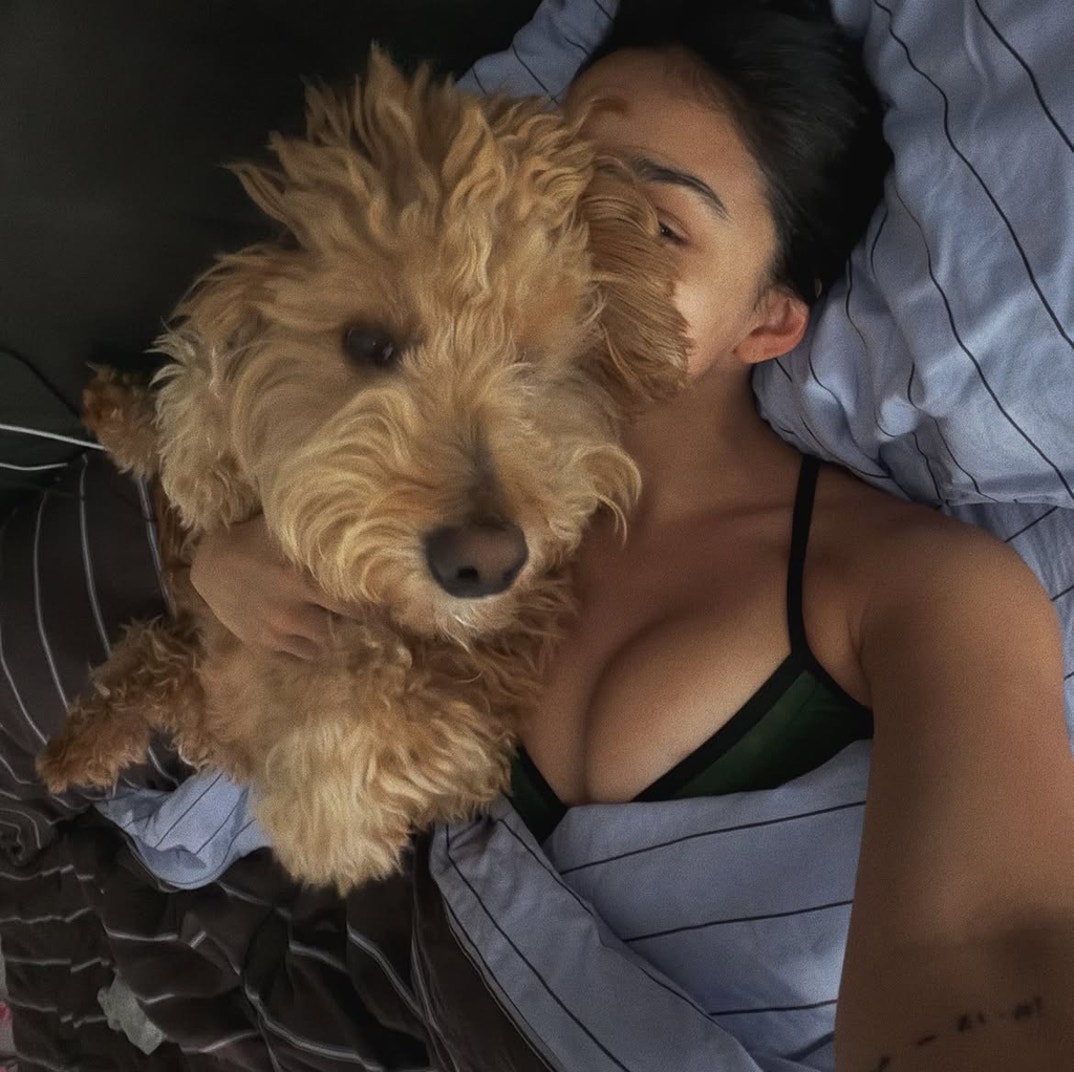 Rachel Zegler Dog Cuddle REVEAL0