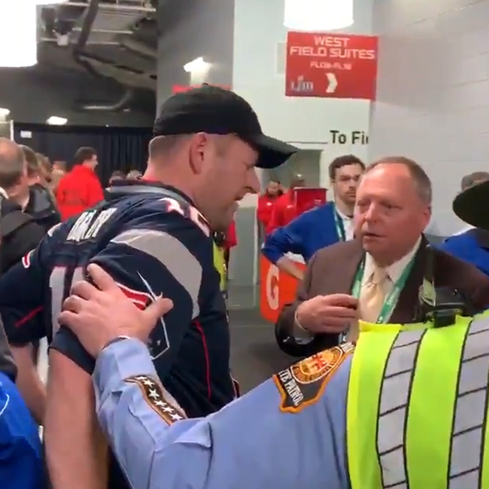 Patriots Fan Tries Sneaking Into Locker Room Celebration Using Security  Guard's Jacket