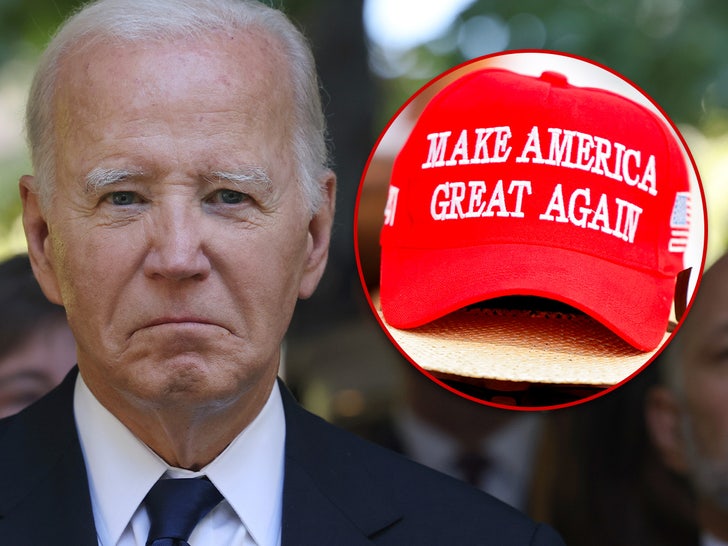 President Biden Wears Trump Hat For Unity, White House Says