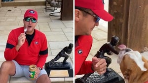 Luke Bryan Makes Bulldog Lick Peanut Butter Off Tim Tebow’s Heisman, ‘Go Georgia!’