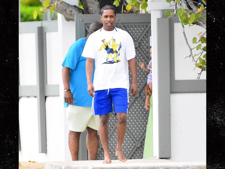 Rihanna relaxes in bikini as ASAP Rocky jet skis on Barbados holiday before  gun charge bombshell