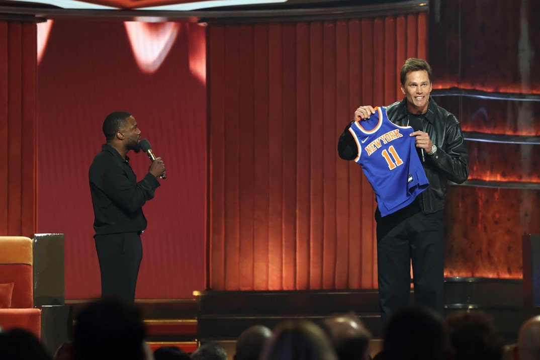 Kevin Hart and Tom Brady speak onstage during Netflix Is A Joke Festival Presents: The Roast of Kevin Hart