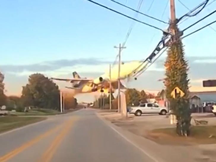 UPS plane flies low over Kentucky road