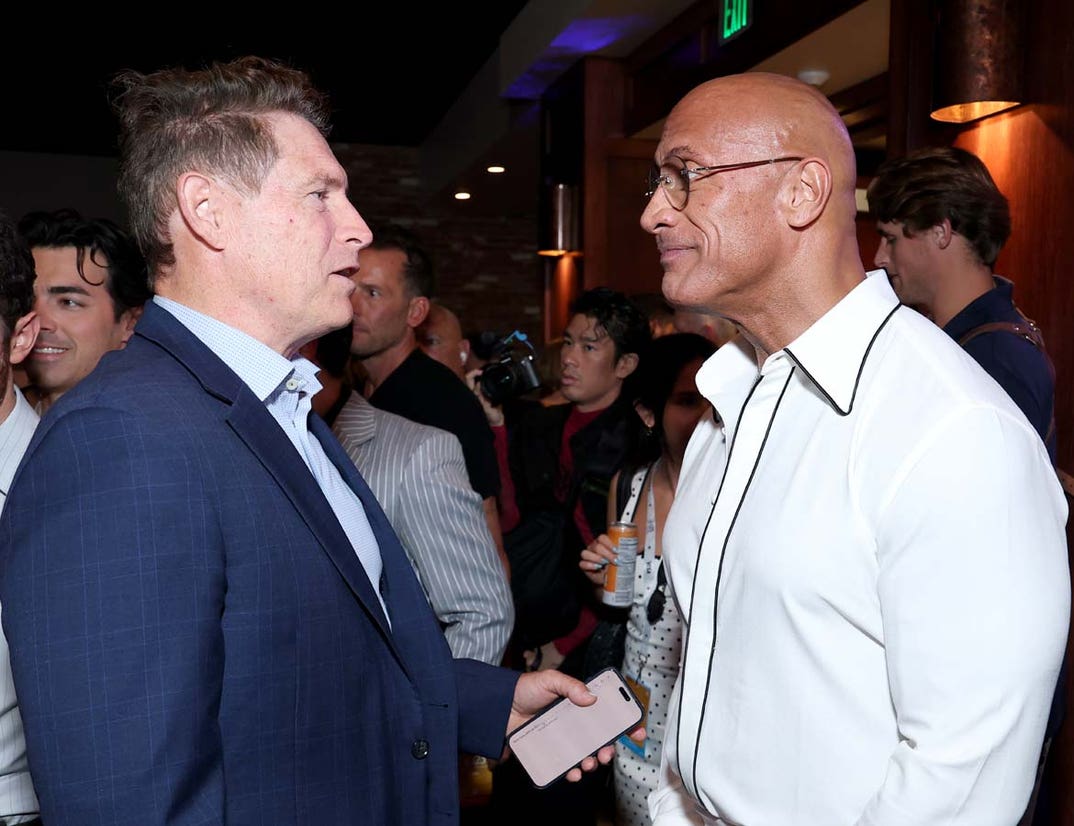 Steve Young and Dwayne Johnson