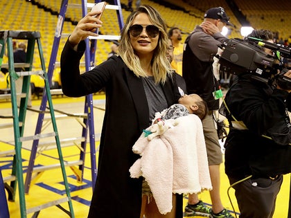 0603_chrissy_teigen_john_legend_baby_game_one_nba_finals