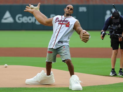 Ludacris Throwing Out The First Pitch With Exaggerated Arms And Shoes