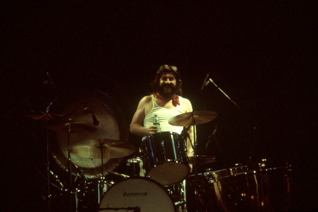 John Bonham of Led Zeppelin performing live onstage.