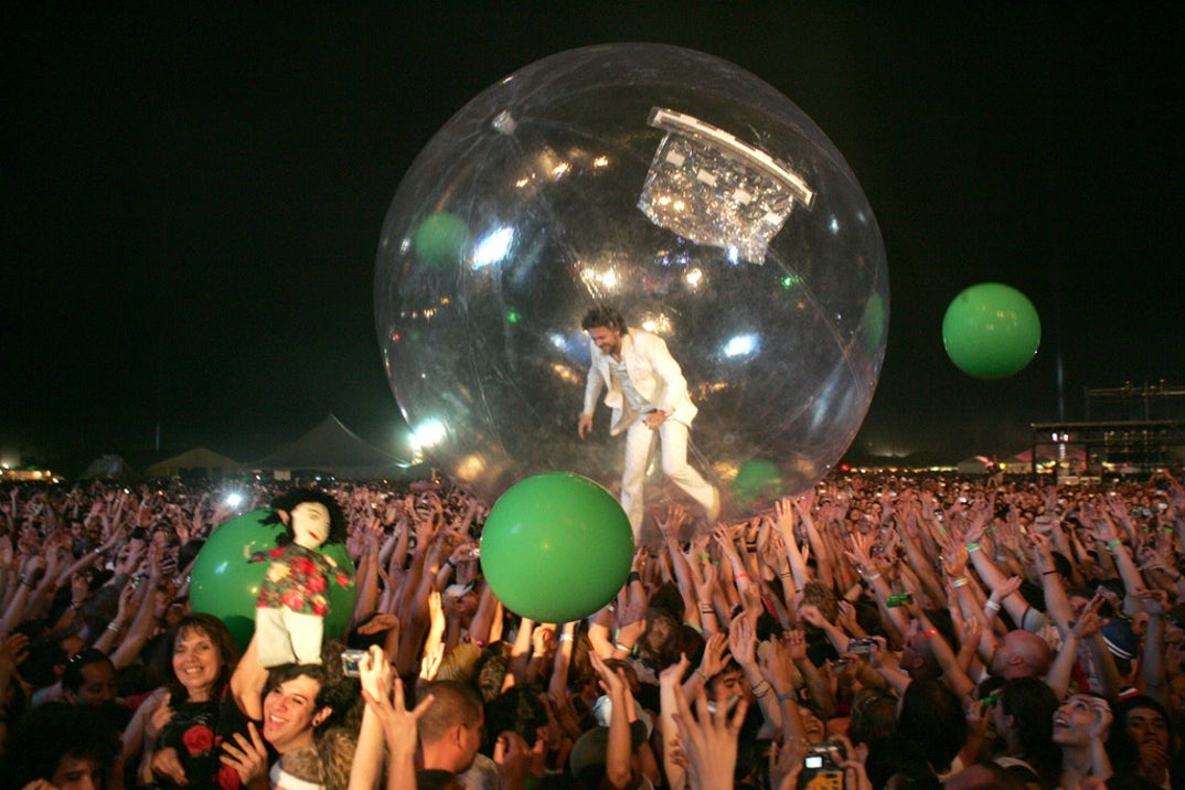 2004: Wayne Coyne of The Flaming Lips crowd surfs in a giant bubble