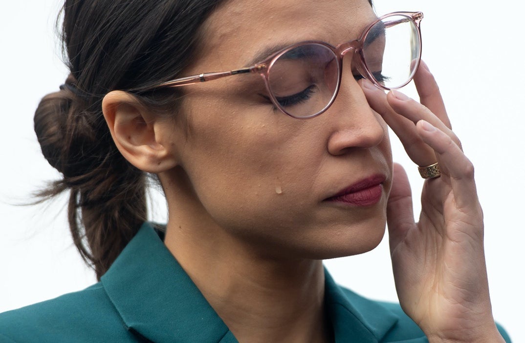 US Representative Alexandria Ocasio-Cortez, Democrat of New York, sheds a tear during a press conference calling on Congress to cut funding for US Immigration and Customs Enforcement (ICE) and to defund border detention facilities, outside the US Capitol in Washington, DC.