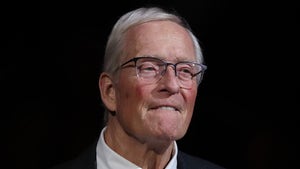 Dick Van Arsdale Wearing Glassing And A Purple And Orange Tie