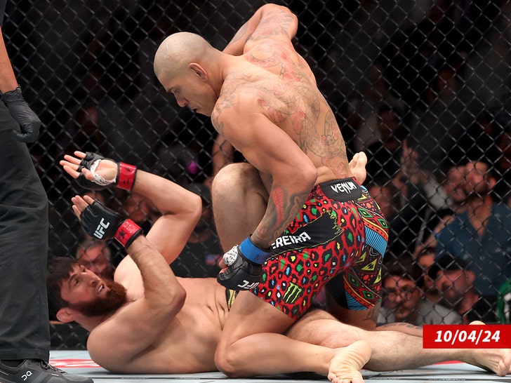 Alex Pereira of Brazil (R) punches Magomed Ankalaev getty