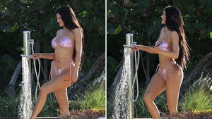 Kylie Jenner Sprays Herself Off With Hose in Pink Bikini, Loving Single Life