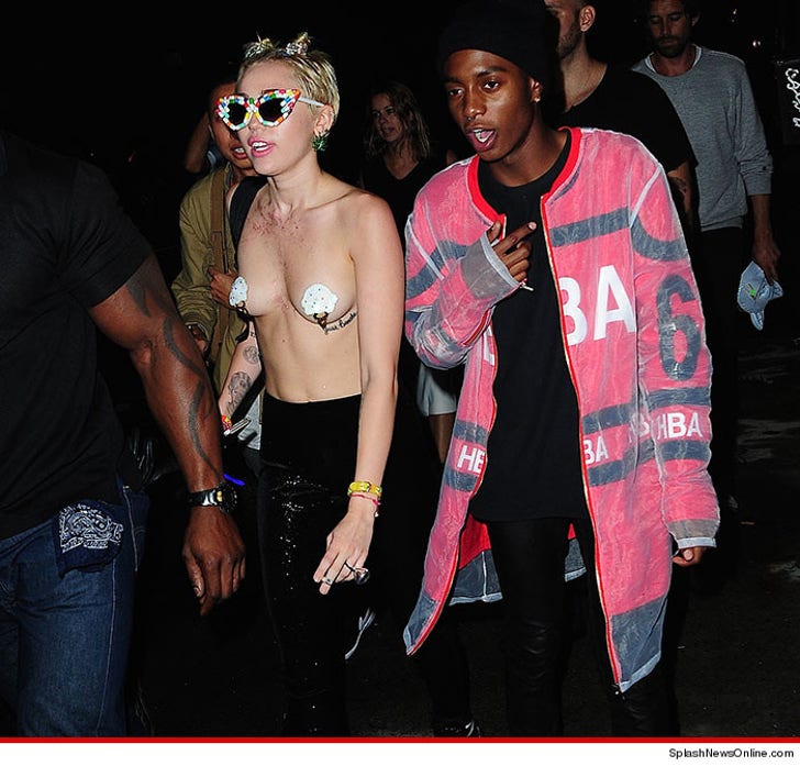 Topless Miley Cyrus wears novelty nipple tassels to Vera 