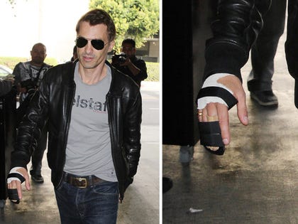 1127_olivier_martinez_article_hand_brace_injured_gsi