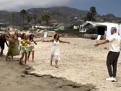 Mel owens ilms at Zuma Beach in Malibu with his female candidates BACKGRID 2