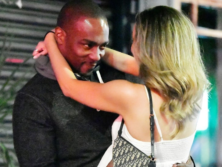 0813-Anthony-Mackie-Kissing-Woman-SUB-1