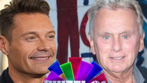 0609 Ryan Seacrest Pat Sajak wheel getty comp