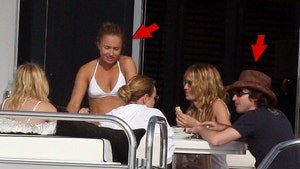 Hayden Pannettiere and James Blunt relaxing on a boat splash