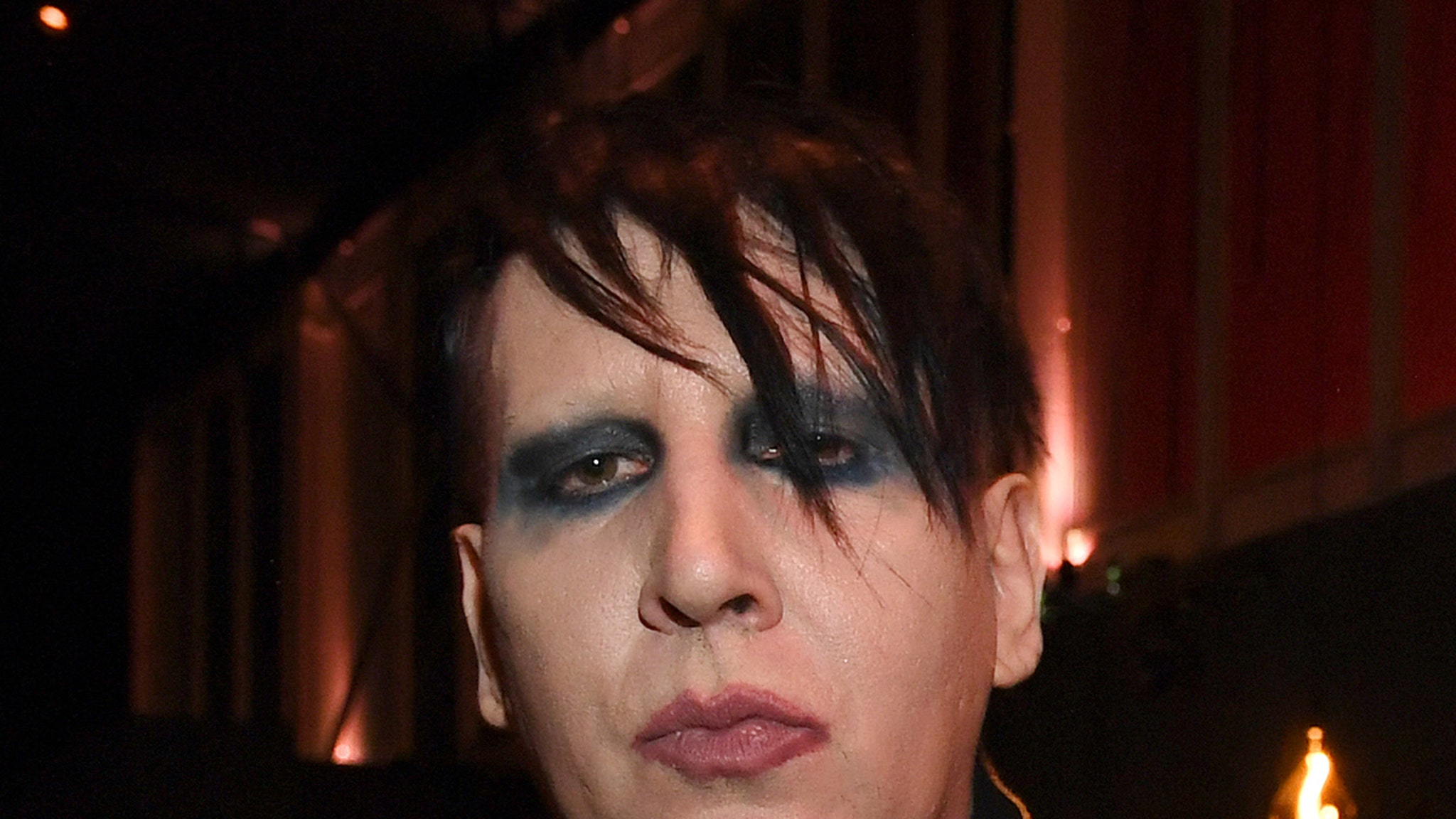 Policemen investigating allegations of abuse by Marilyn Manson