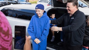 Sophia Forchas and her father, Tom Forchas, leave the Hennepin County Medical Center AP