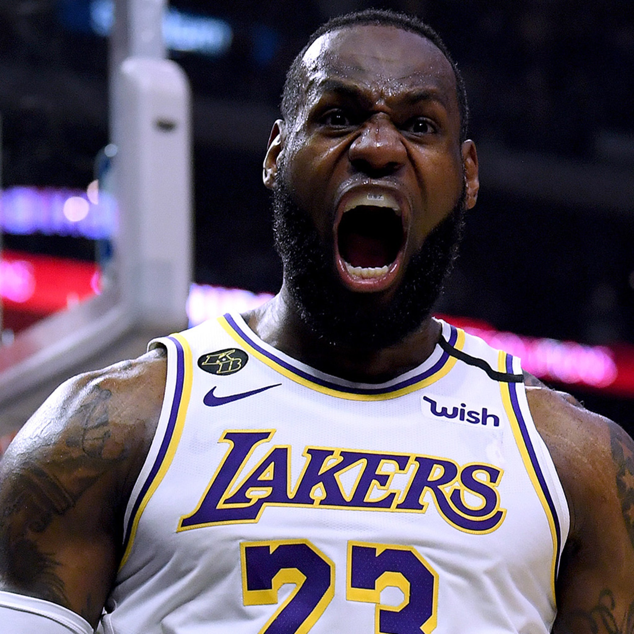 Download LeBron James Showing Support for the Lakers in Purple