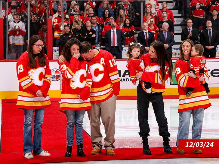 The Gaudreau family are honoured before the game between the Calgary Flames and the Columbus Blue Jackets at Scotiabank Saddledome