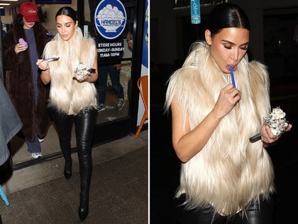 Kim Kardashian Eating Handles Ice Cream In a White Fur Vest