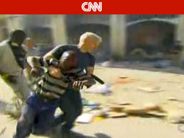 2010-0119-anderson-cooper-haitian-hero