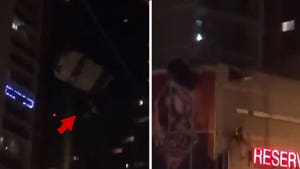 Guy Parachutes Right Into Apartment Building in Cleveland at Night