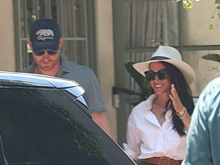 Prince Harry and Meghan Markle Leaving an Office