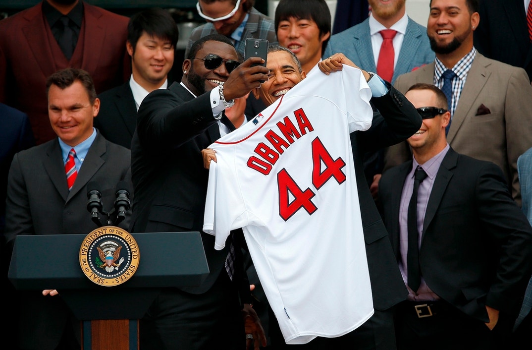 Boston Red Sox designated hitter David Ortiz (3rd L) poses for a 