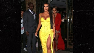 Kim Kardashian Out in Super Low-Cut Versace Gown for Met Gala Follow-Up