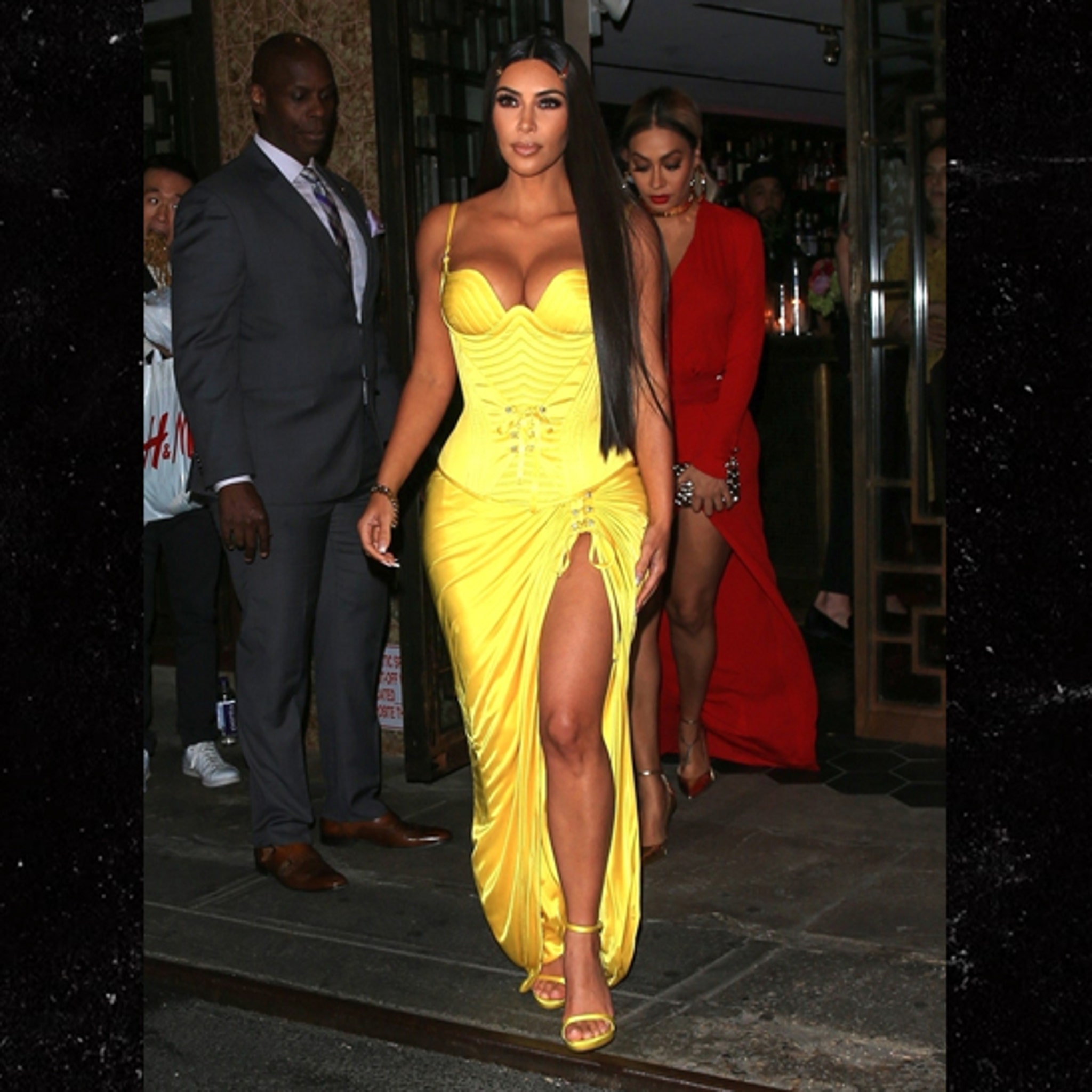 Kim Kardashian Out in Super Low-Cut Versace Gown for Met Gala