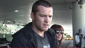 0912-sam-worthington-tmz-01