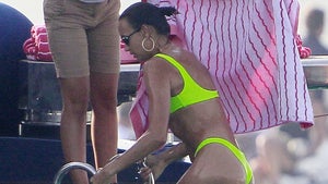 Irina Shayk Takes a Dip in Ibiza in Neon Bikini