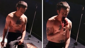 The 1975's Matty Healy Eats Raw Meat Onstage During Concert