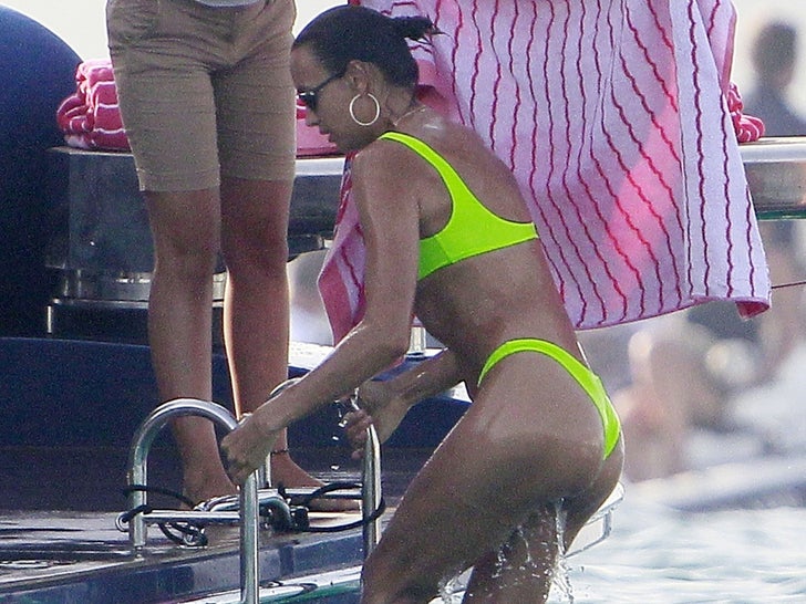 Irina Shayk Takes a Dip in Ibiza in Neon Bikini