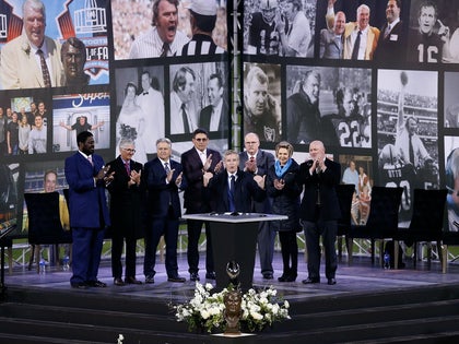 Guest speakers stand on stage during a memorial service held for Hall of Fame NFL coach and broadcaster John Madden at RingCentral Coliseum on February 14, 2022 in Oakland, California.