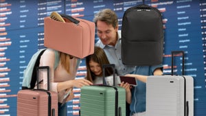 Family At An Airport Surrounded By Away Luggage Available On Amazon