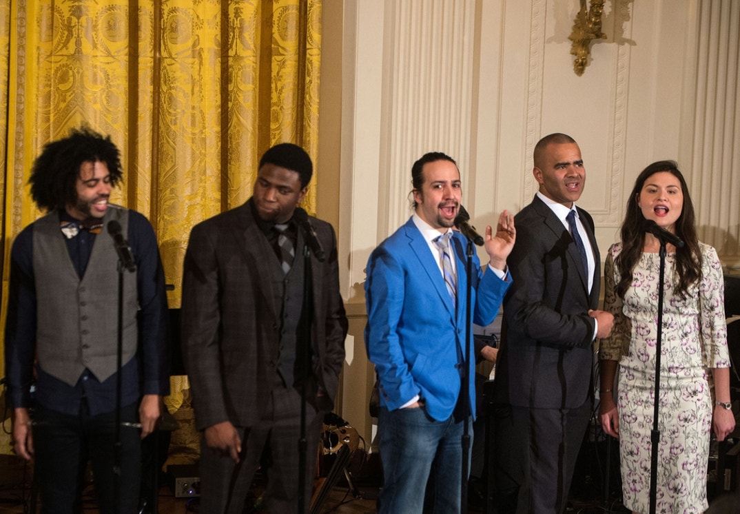 Members of the Broadway cast of the musical Hamilton, including Lin-Manuel Miranda (C), creator and star of the show about the first Treasury Secretary Alexander Hamilton, perform selections of the show in the East Room of the White House in Washington, DC, on March 14, 2016.