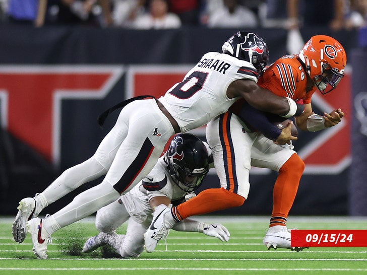 Caleb Williams #18 of the Chicago Bears is sacked by Azeez Al-Shaair #0 of the Houston Texans during the second half at NRG Stadium on September 15, 2024 in Houston, Texas